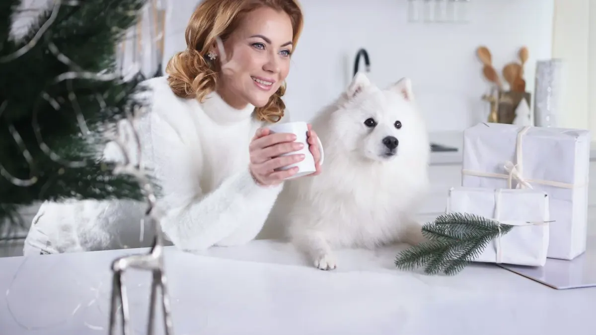 A dog owner reading the ingredient panel on a supplement bottle at a kitchen counter