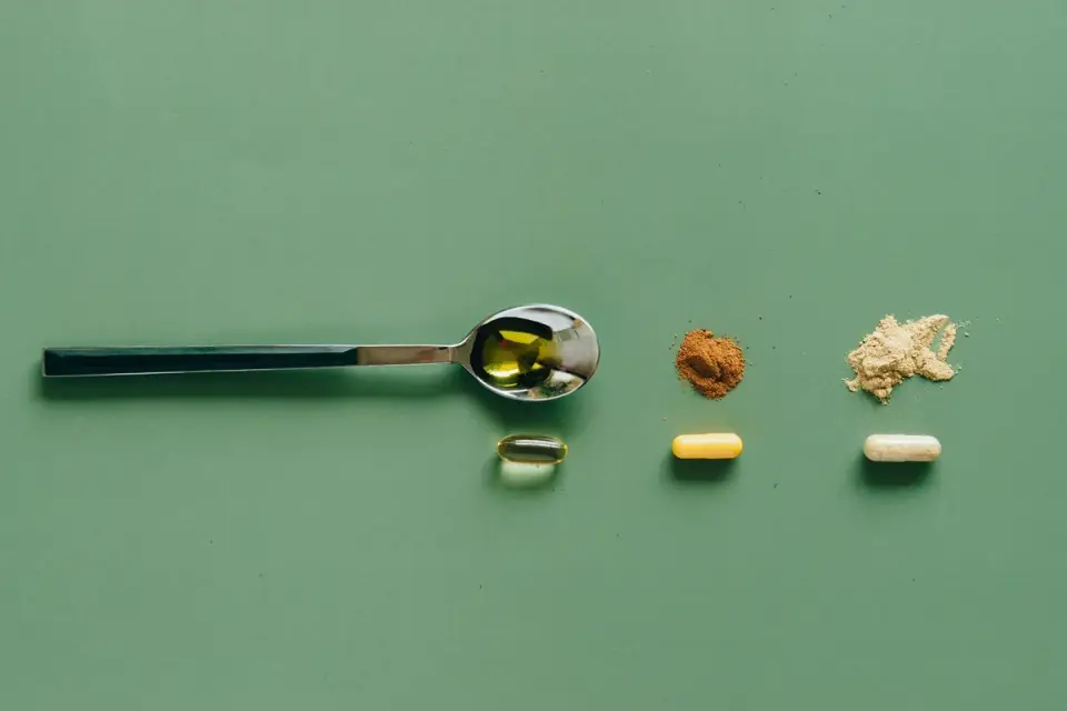 A scoop resting in slightly damp dog supplement powder