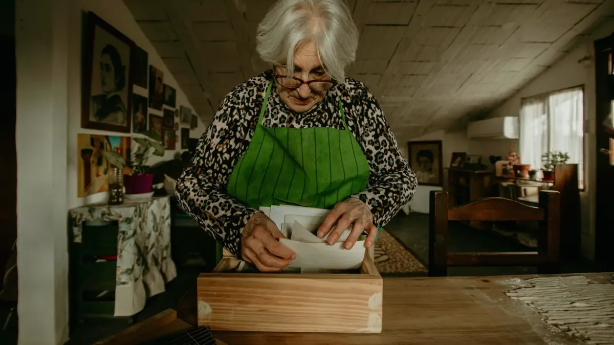 An owner reading the guaranteed analysis panel on a dog supplement bag in a kitchen