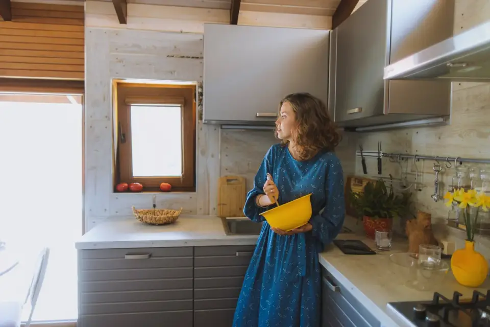 Dog owner preparing dog food kitchen