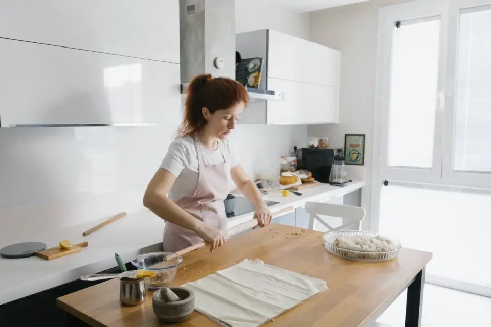Dog owner preparing dog food kitchen