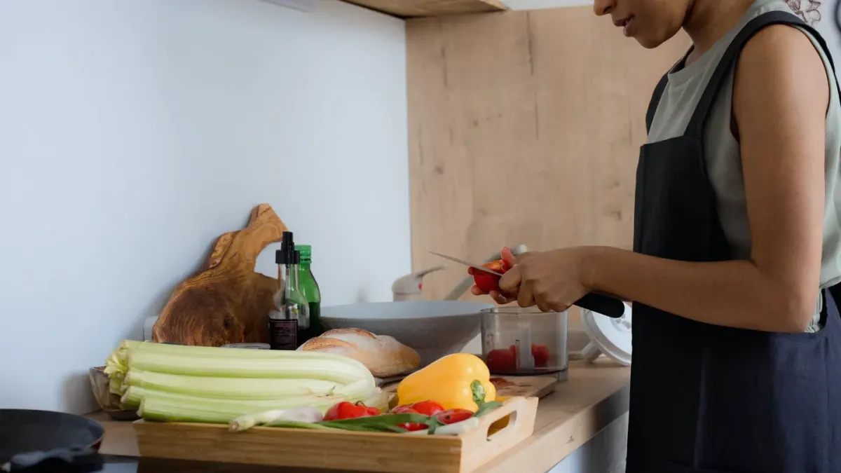 Dog owner preparing dog food kitchen