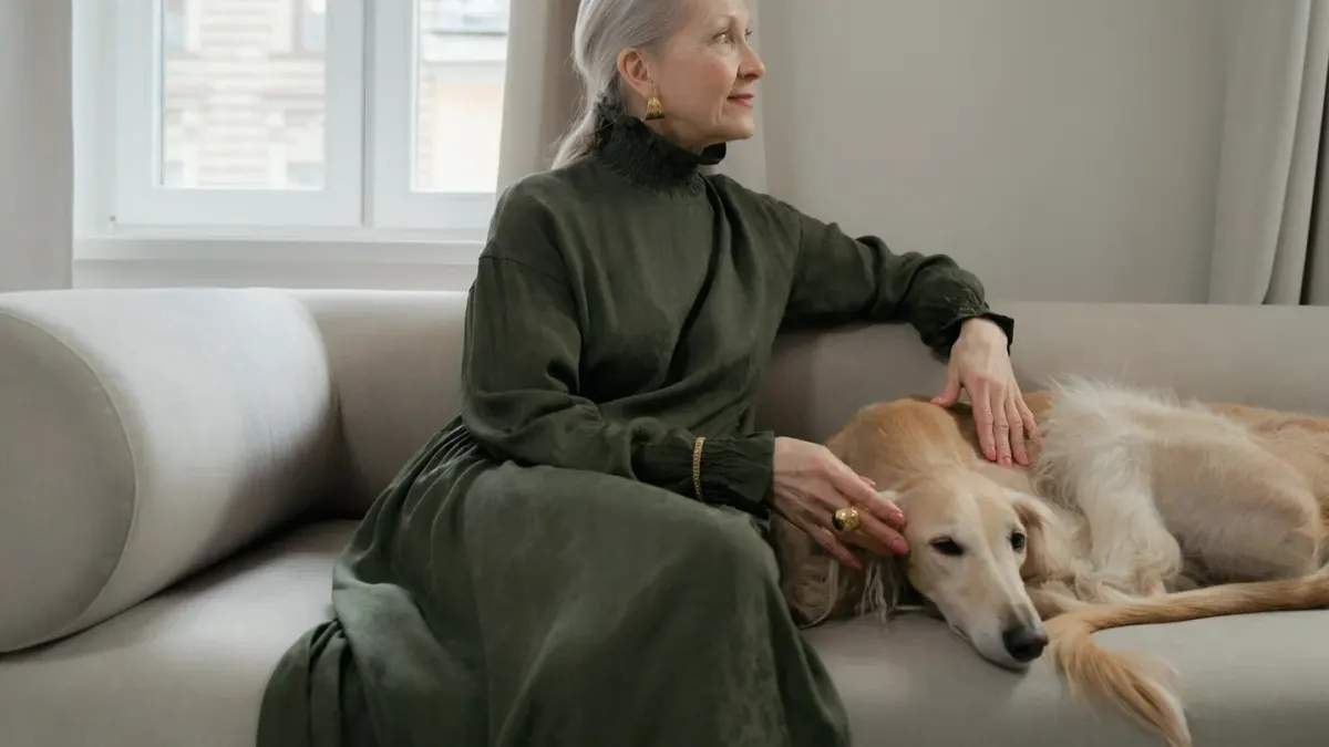 Dog resting beside an owner